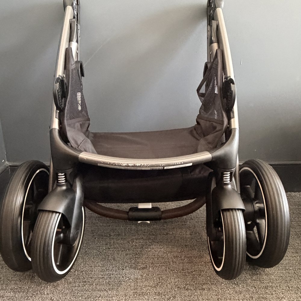 A cleaned stroller frame, basket and wheels